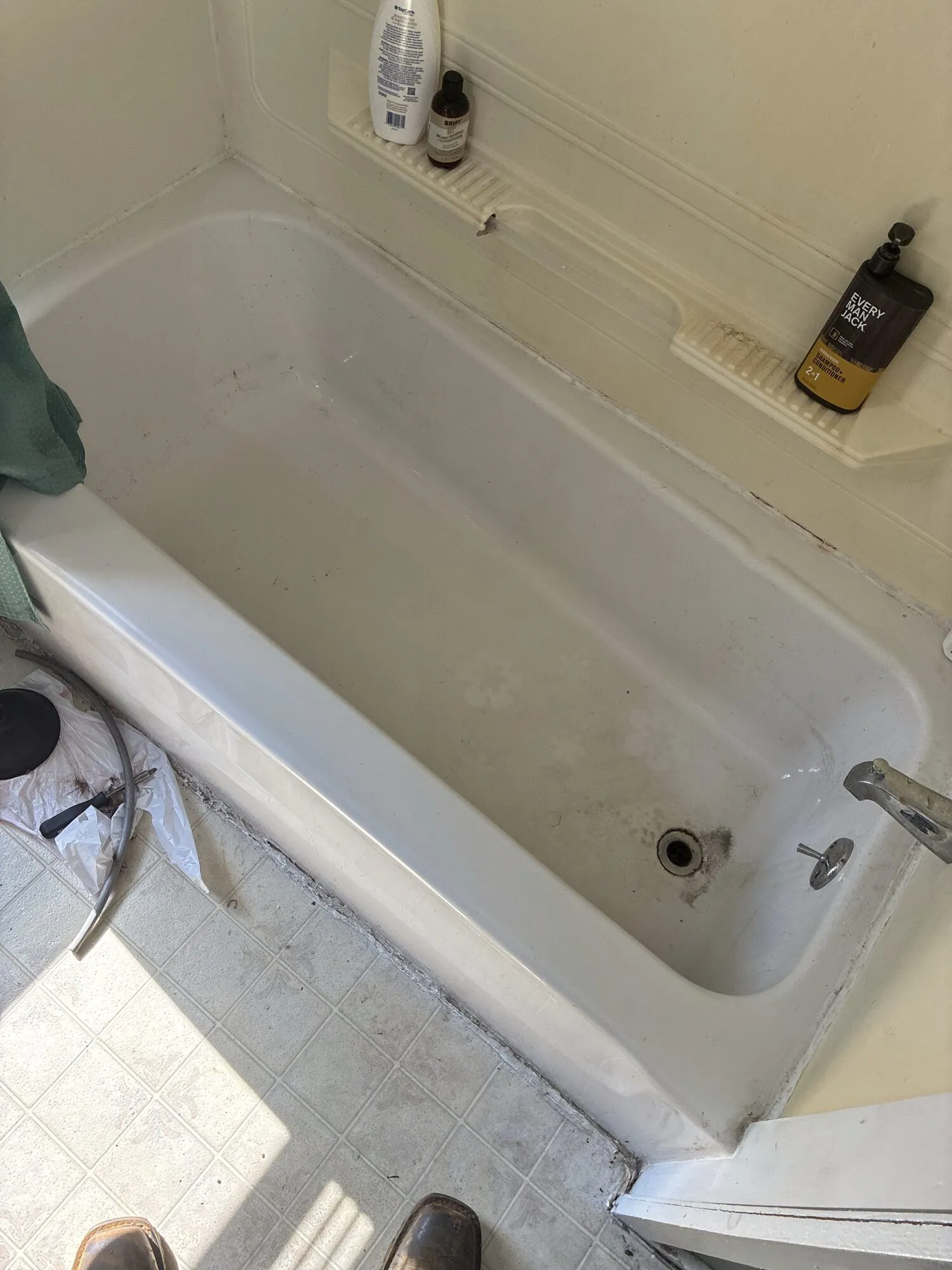 The same tub after clearing, drained and clean