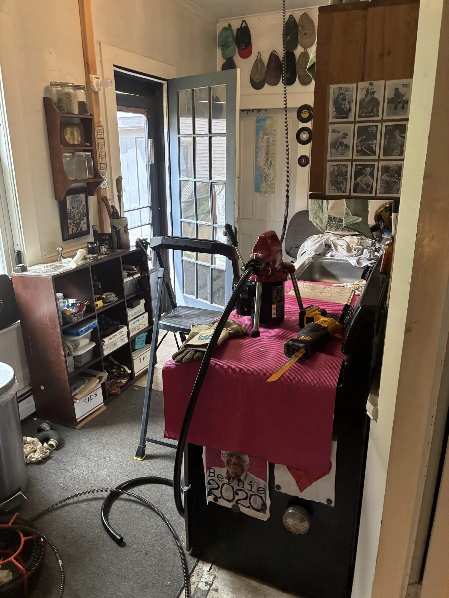 A drain machine running a cable into a line inside a home